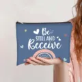 Blue canvas makeup pouch with 'Be Still and Receive' text and a cute rainbow print - Deep Blue (Be still and receive)