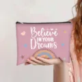 Pink canvas makeup bag featuring 'Believe In Your Dreams' quote and rainbow pattern - Pink (Believe in your dreams)