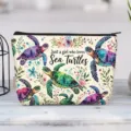 Detailed view of the vibrant sea turtle print on a high-quality canvas makeup bag. - Sea Turtles Illustration