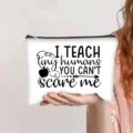 Close-up of white canvas makeup bag with I TEACH tiny humans print - Teacher Motto Print (jiayingpbb0661)