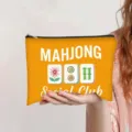 Oranje make-uptas met mahjong-opdruk en een handige, zeer stevige ritssluiting - Oranje (Mahjong Social Club)