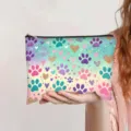 Vibrant watercolor gradient cosmetic pouch with paw and heart print held in hand - Dreamy Watercolor Paw Print (jiayingpbb0665)
