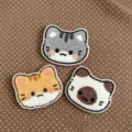 Close-up of three cute plush kitten hair patches in grey, orange, and white colors - Three-Piece Set