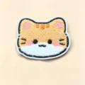 Detailed view of a cute plush cat hair patch featuring soft and fluffy embroidered texture - Golden Tabby Cat Fringe Pad