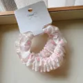 Detail view of a white cotton scrunchie with pink polka dots and bow pattern lace edge - 2 Pieces/Pack / Pinkish