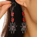 Gothic punk spider drop earrings featuring red faceted crystal beads and silver pendants. - Gunmetal Spider Long Tassel (1044)