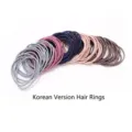 Detail view of high-quality seamless thin elastic hair ties in various muted colors. - 100 Pieces/Pack (OPP Bag) / Multicolor