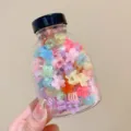 Close-up of vibrant colorful flower-shaped mini hair clips stored in a transparent jar - 2# Jelly Flower Style