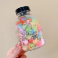 Transparent jar filled with colorful mini crown hair clips for kids and toddlers - 3# Jelly Crown Style