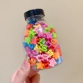 Macro view of colorful mini flower hair clips for kids packed in a transparent jar - 4# Vivid Flower Style