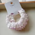 Close-up of cotton ruffled scrunchie with purple floral pattern and lace edge - 2 Pieces/Pack / Purple Tones