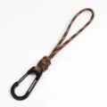 Detailed view of the handmade paracord keychain lanyard with a black metal carabiner hook. - Red Maple Forest