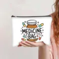 White canvas makeup pouch featuring a cute cartoon medicine bag and capsules print - Medicine Bag Print (jiayingpbb0678)