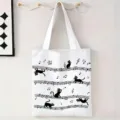 Bolso tote de lona blanca con divertido estampado de gato negro y notas musicales, vista SKU - Arte de Línea Gato Notas de Música / 34x39cm