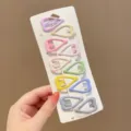 Detailed view of ten heart-shaped pastel hair clips organized on a white display card. - Hollow Heart (6#) / 10 Pieces/Pack / Candy Multi-color