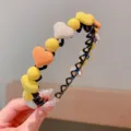 Decorative girl's headband with colorful hearts and beads for stylish hair styling. - Heart Style / Yellow