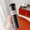 Pack of 100 black seamless high elasticity hair ties in a clear cylinder container - 100 Pieces Set / Black