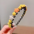 Charming children's zigzag headband featuring plush stars and yellow beads in warm tones. - Star Style / Yellow