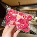 Assorted pink elastic hair ties for girls in a decorative daisy zip storage bag - 50Pcs/Bag / Pink Series (12#)