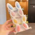 Detailed view of soft plush rabbit ear hair clips for girls in various pastel colors. - Purple Rabbit Ears