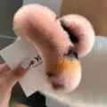 Close-up of large pink Rex rabbit fur hair claw clip with plush tri-color texture - Large Hair Claw / Pink Leopard