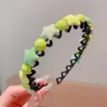 Light neon green zigzag headband featuring fabric stars and round beads for girls and children - Star Style / Green