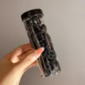 Bulk pack of small black elastic hair ties stored in a transparent cylinder bottle - 100 Pieces/Jar / Black (#2)