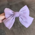 Elegant lavender pearlescent satin bow hair clip with a mermaid finish for women - Purple