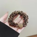 Elegant leopard print scrunchie with sparkling gold rhinestone ball decoration for hair - Leopard Print