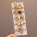 Lot de 5 élastiques à cheveux marron pour enfants avec de jolis nœuds et fleurs en tissu. - 5 Pièces / Oreilles de Lapin à Carreaux