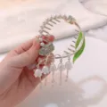 Close-up of lily of the valley tassel hair claw clip with pearl and rhinestone detail - Butterfly Lily of the Valley
