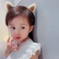 Cute plush animal ear hair clip worn by a toddler girl, perfect for lovely hair styling - Coffee Cat Ears