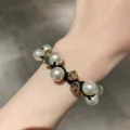 Elegant white pearl and amber crystal bead dual-use bracelet hair tie worn on wrist - White Pearl Hair Tie