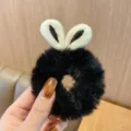 Cute rabbit ear plush scrunchie made of soft black and white fuzzy plush fabric - Black