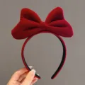 Vintage red velvet headband with a large bow, perfect for a classic festive holiday look - Red Bow