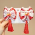 Close-up detail of Chinese New Year red bow hair clips with rabbit charms and tassels - 3D Rabbit Tassel Style (D169---10)
