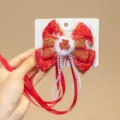 Close-up of Chinese New Year red bow hair clip with pearl tassel and Fu character - Fortune Pearl Chain Tassel Style (D169----20)