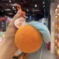 Cute orange Rex rabbit fur pom pom keychain with fuzzy blue leaf and decorative tag - Orange and Blue (Real Rex Rabbit Fur)