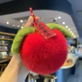 Cute red rex rabbit fur plush ball keychain with decorative green leaves and red tag - Red Blessing (Faux Fur)