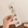 Cute 5-piece toddler hair clip set with rabbit and flower patterns on fabric wrap. - Brown Rabbit (BD3975)