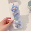 Cute blue fabric-wrapped hair clip set featuring flower and bow designs for baby girls - Blue Smile (BD3975)