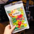 Grootverpakking kleurrijke elastische haarbandjes voor kinderen in een ritszakje - 50 stuks zak / Fluorescerende kleuren