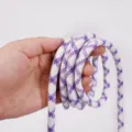 Close-up detail showing the purple and white braided texture of the 8mm phone lanyard cord. - 8mm Purple and White