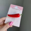 Handheld realistic red chili pepper shaped hair clip on a pink fashion jewelry card - 2 Pieces/Pack / Chili