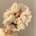 Elegant cream lace scrunchie featuring polka dots and a dainty black bow hair tie - Beige Polka Dot Trim