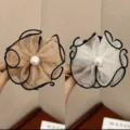 Detail shot of flower-shaped mesh hair claws with pearls in beige and white colors. - Cream White and Champagne