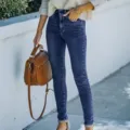 Detailed shot of women's slim stretch skinny jeans in dark blue, high-waisted casual denim pants. - S / Dark Blue