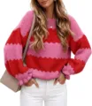 Close-up detail of the vibrant pink and red color block knit sweater with comfortable crewneck. - S / Rose Red