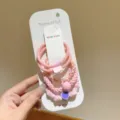 Set mit 4 rosa elastischen Haarbändern mit Herzanhänger auf weißer handgemachter Karte - 5er-Pack / Rosa