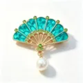 Detailed view of elegant teal enamel fan brooch with green rhinestones and pearl - Blue Fan (XZ380) / Blue
